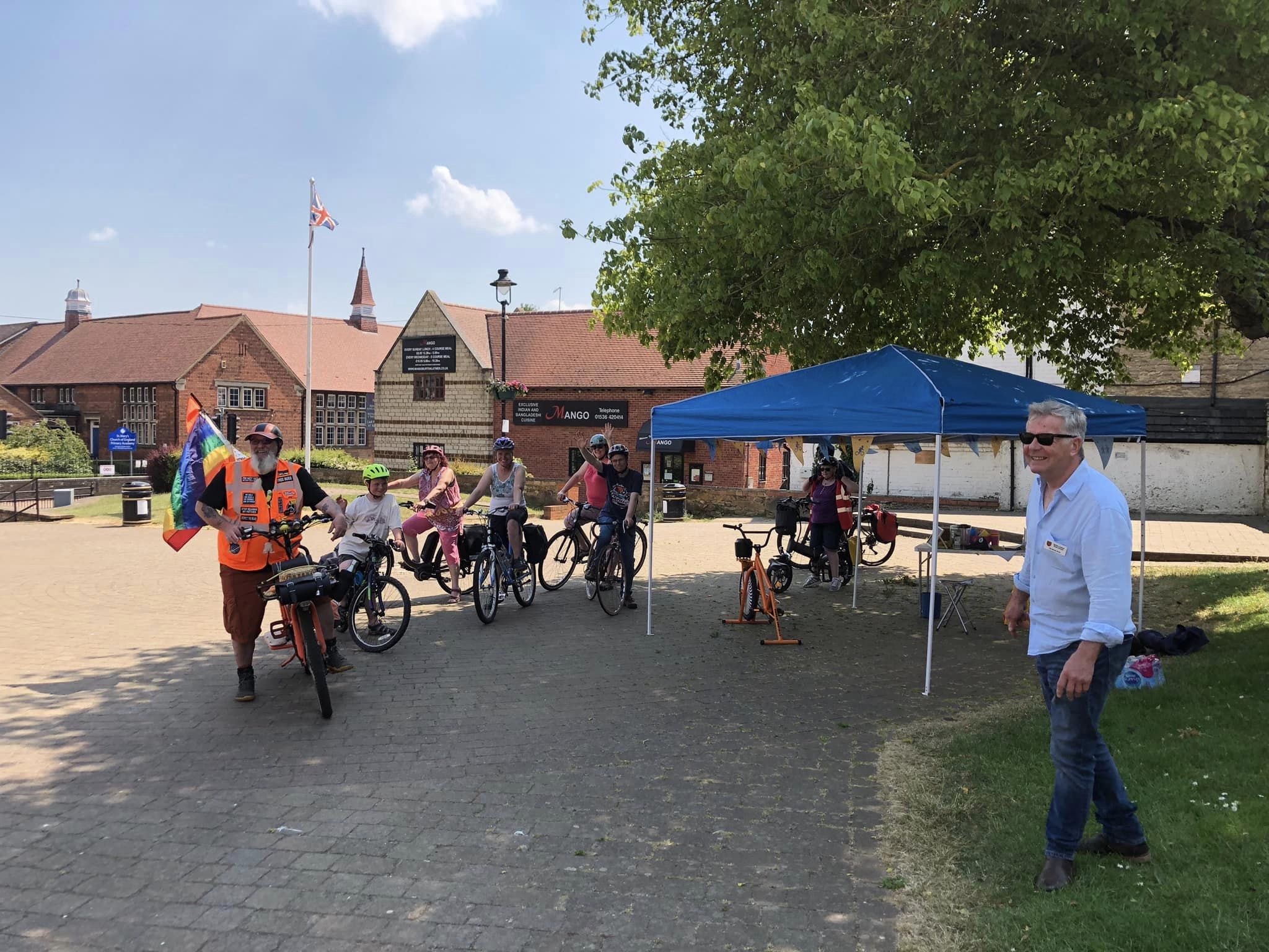 people on bikes with reflective jackets on a warm sunny day