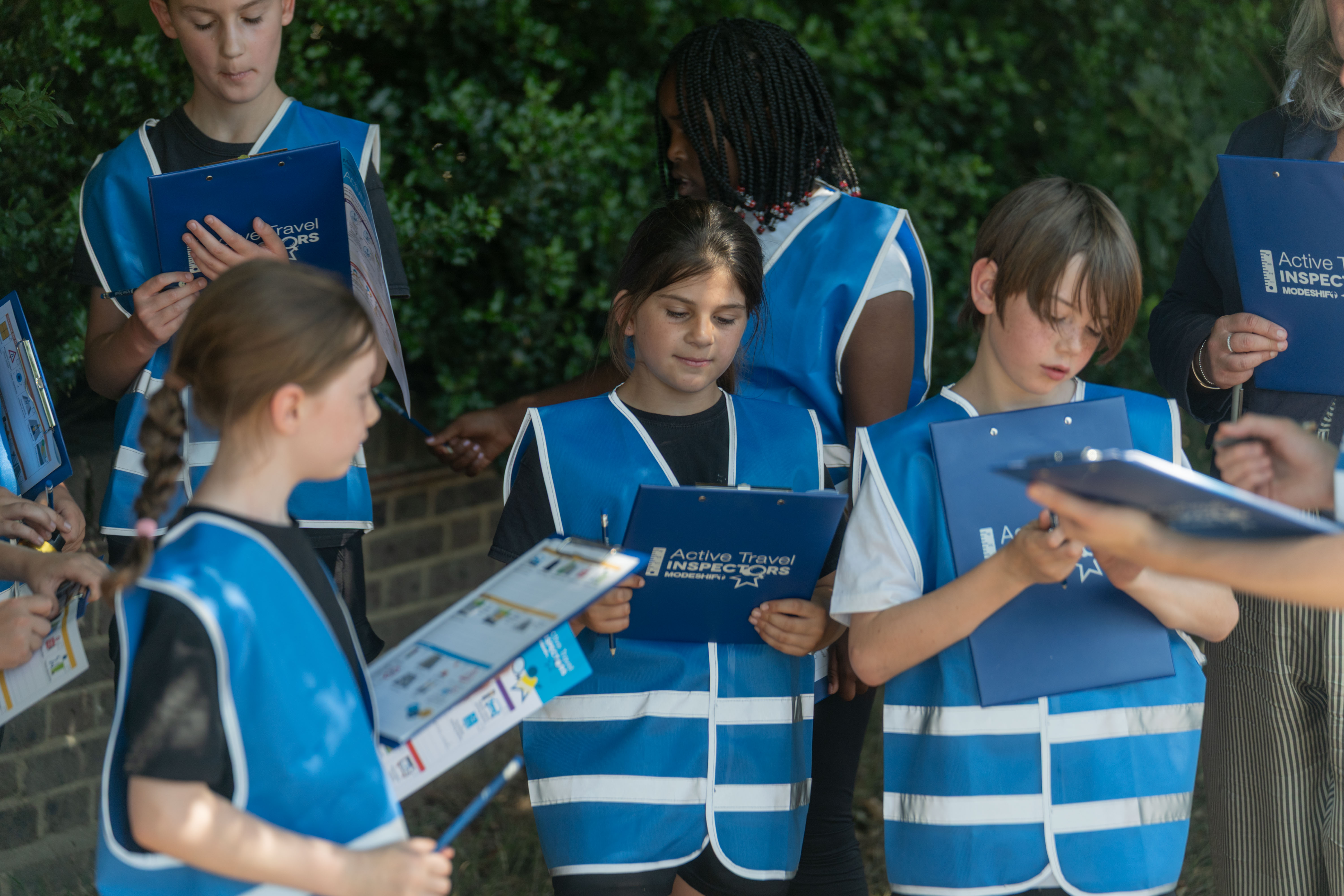 Modeshift Image, ATI inpector kids with clipboards.
