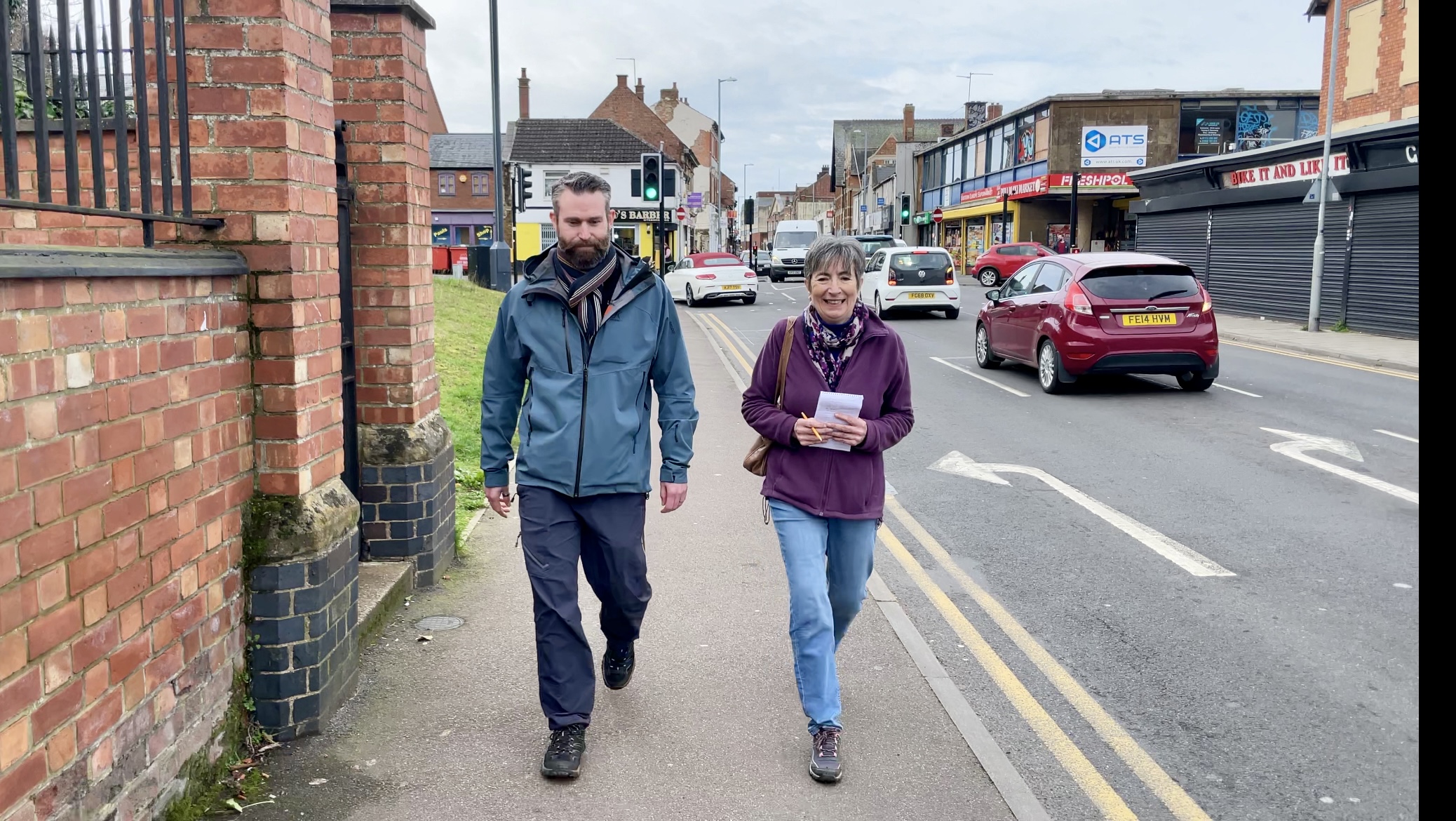 2 pedestrians walking
