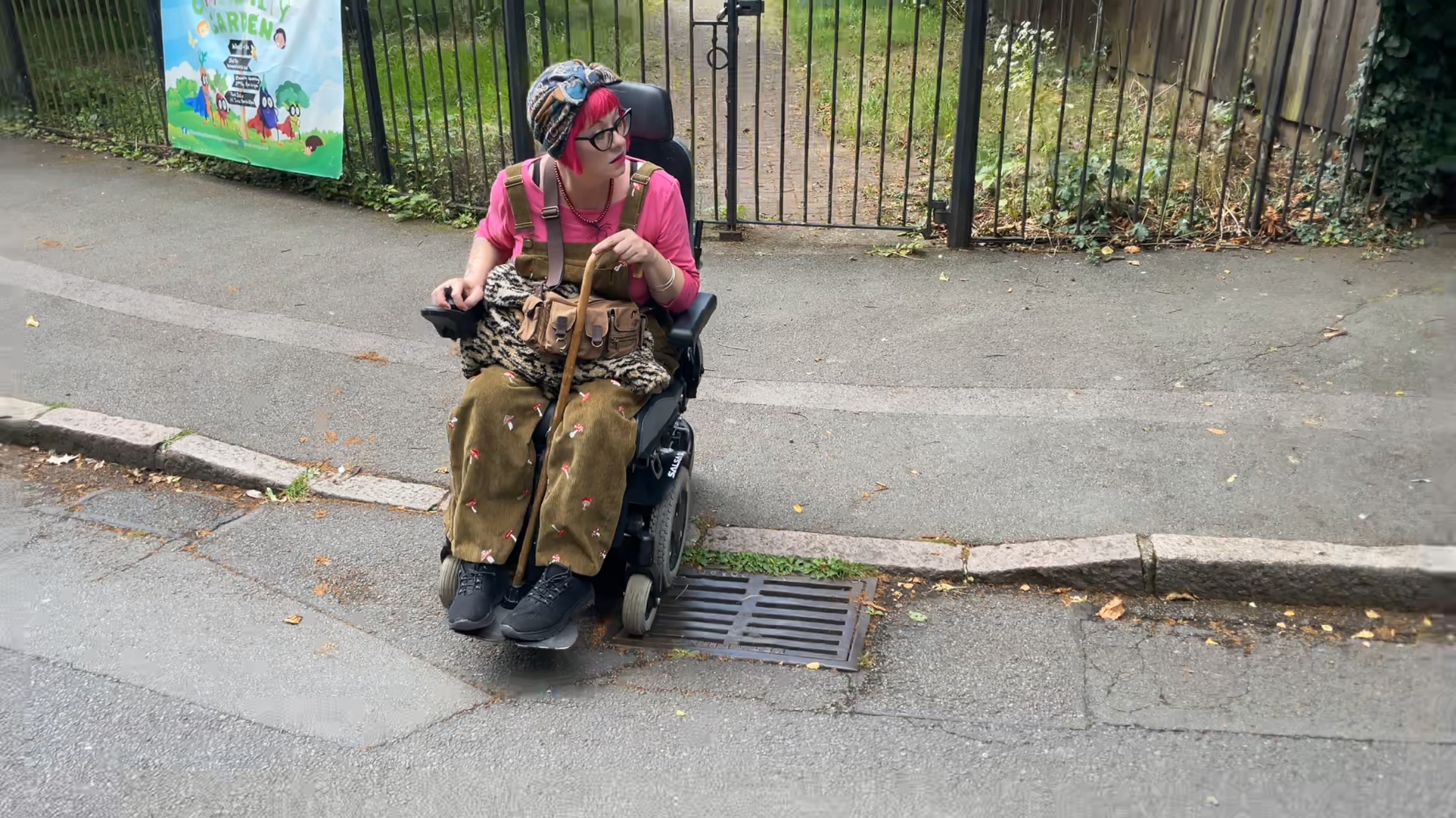 Power chair user crossing on dropped kerb
