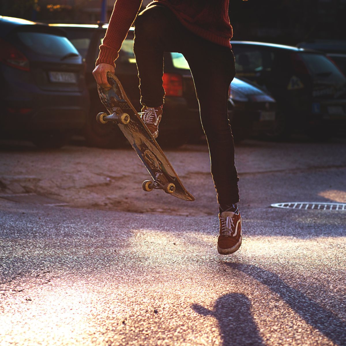 Skateboard with car behind