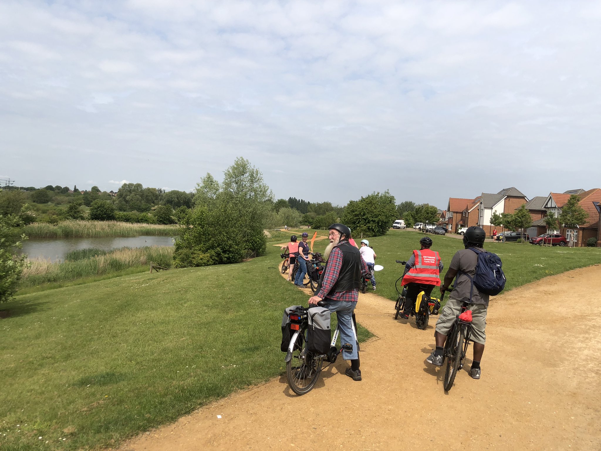 Sunny cycle path with cyclists