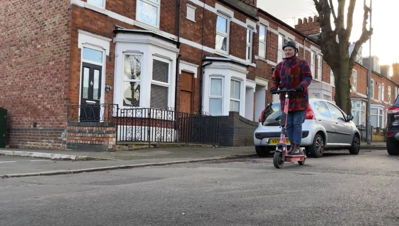 Lady riding an e scooter
