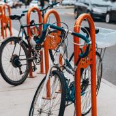 pushbikes locked up to oval cycle storage racks