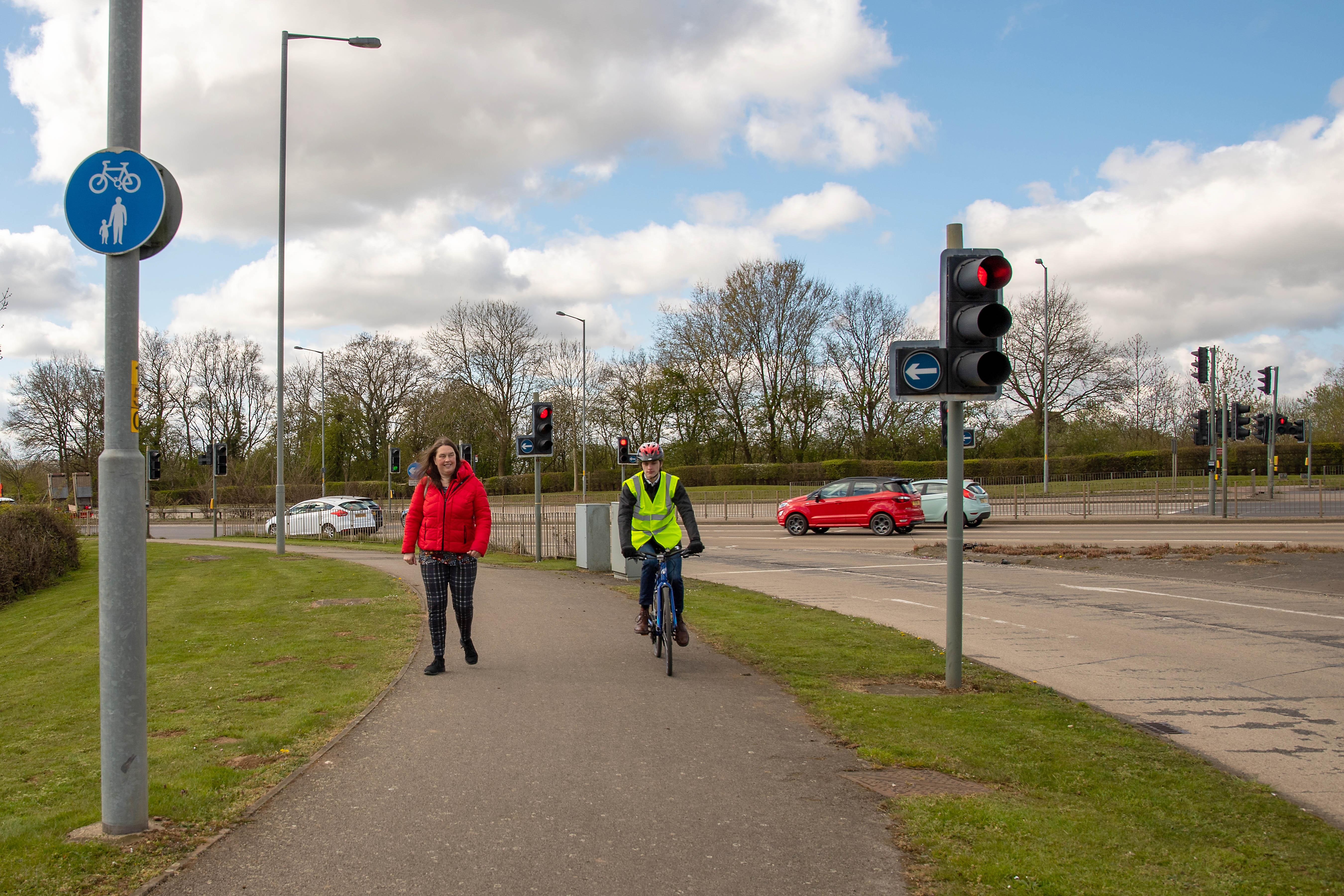 Cyclist and pedestrian on a cycle path.