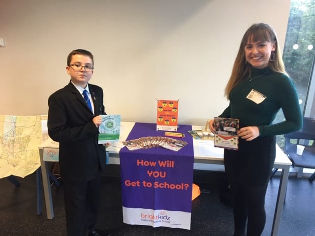 Teacher and a child near a brighkidz presentation table.