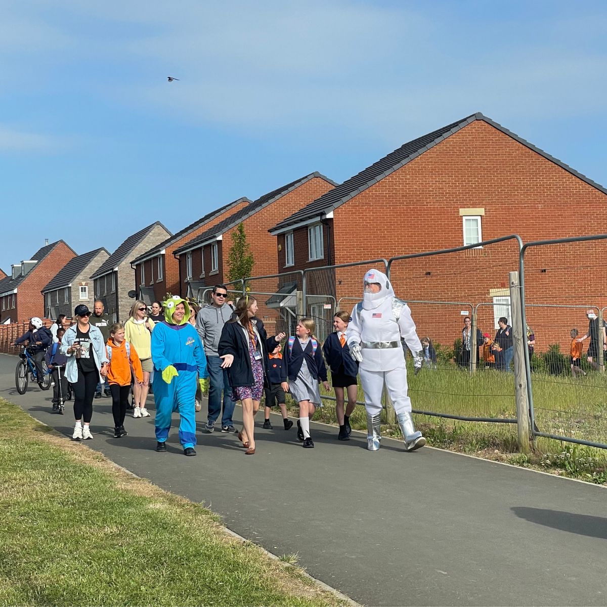 Spaceman walk to school, on corner.