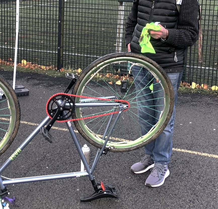 Image of a bicycle upside down being cleaned