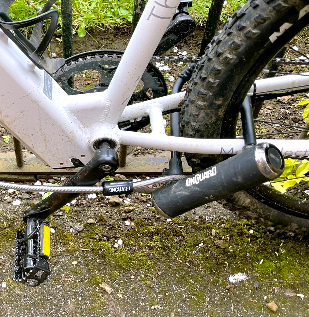 Photo of a bicycle locked to a railing with a D-Lock