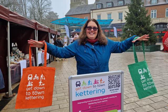 Lady holding 2 shopper bags with 